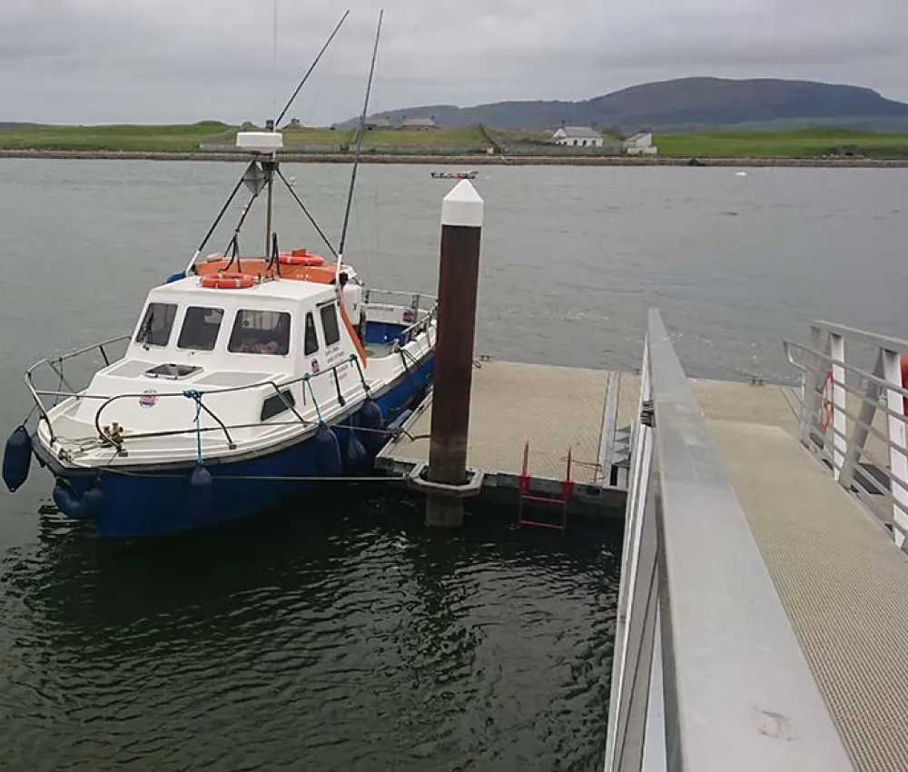 boat with riggers on pontoon